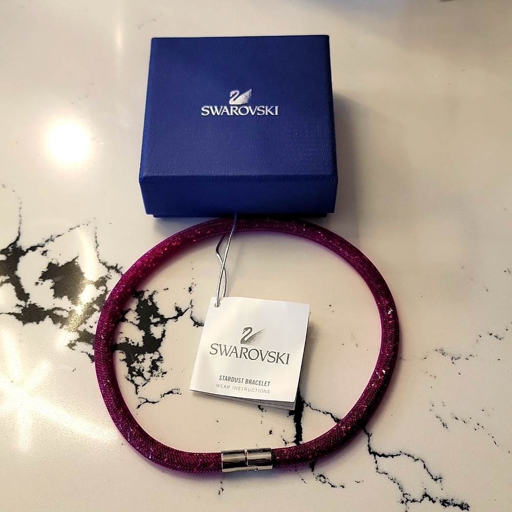 SWAROVSKI STARDUST PURPLE CRYSTAL BRACELET.